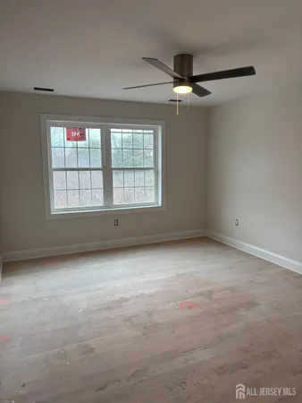 an empty room with a empty space and windows