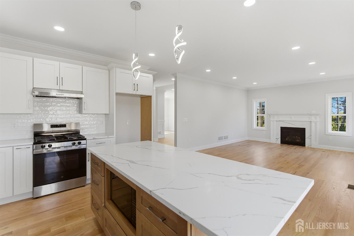 3 Lillian Street Fords, NJ 08863 - Photo 8 of 28 a large kitchen with granite countertop a stove and a sink