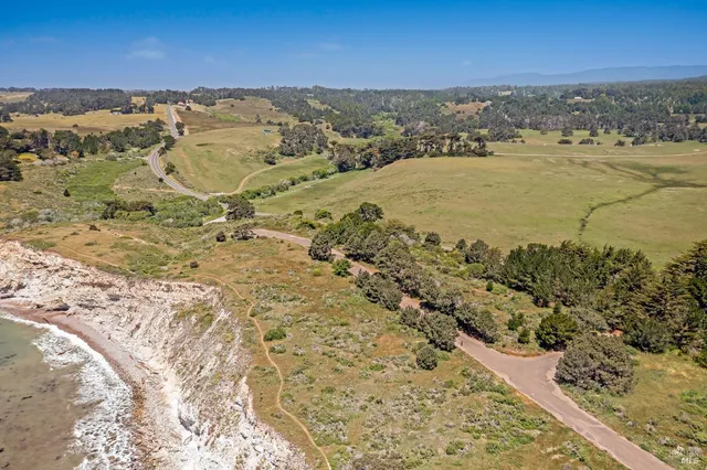 a view of a wooden floor and mountains in the background