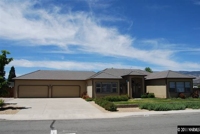 4677 Gold Strike Court Reno, NV 89521 - Photo 1 of 1 a front view of a house with a yard and garage