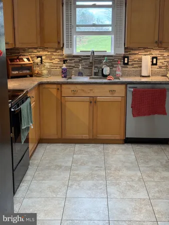 a kitchen with a refrigerator and a microwave