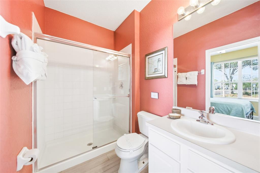 2556 Renshaw Street Kissimmee, FL 34747 - Photo 14 of 26 a bathroom with a sink toilet and shower