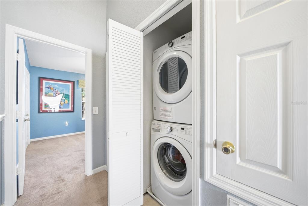 2556 Renshaw Street Kissimmee, FL 34747 - Photo 15 of 26 a view of a hallway with washer and dryer