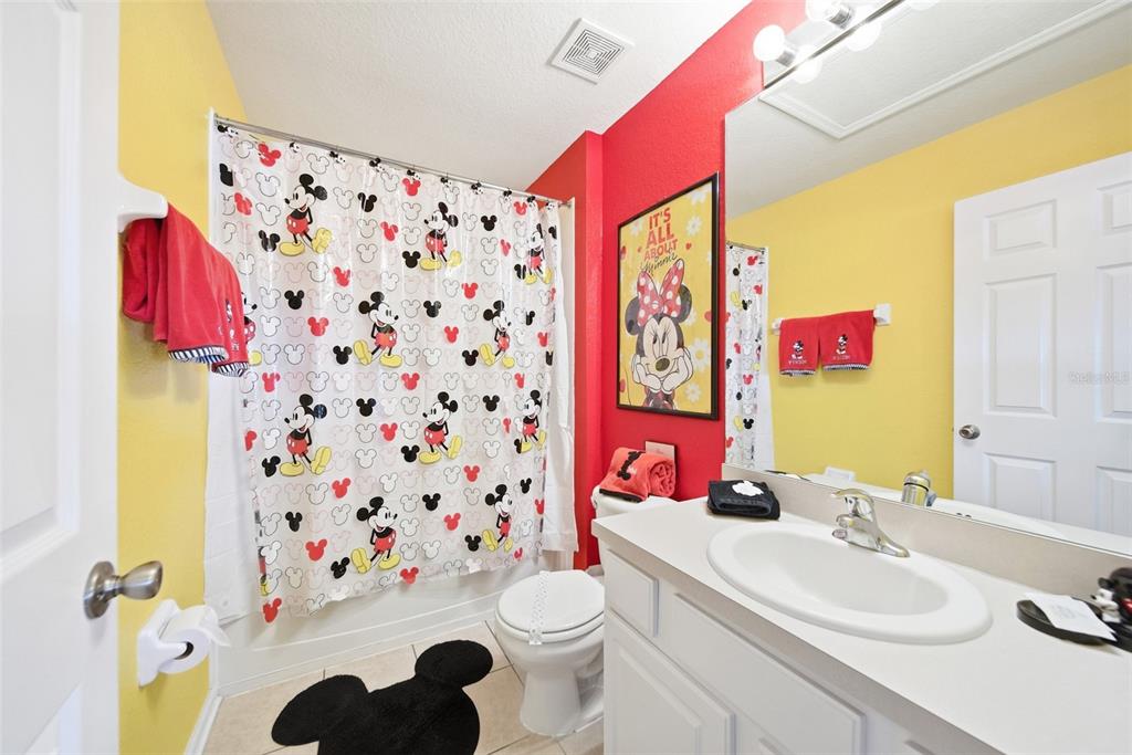 2556 Renshaw Street Kissimmee, FL 34747 - Photo 17 of 26 a bathroom with a sink toilet and shower