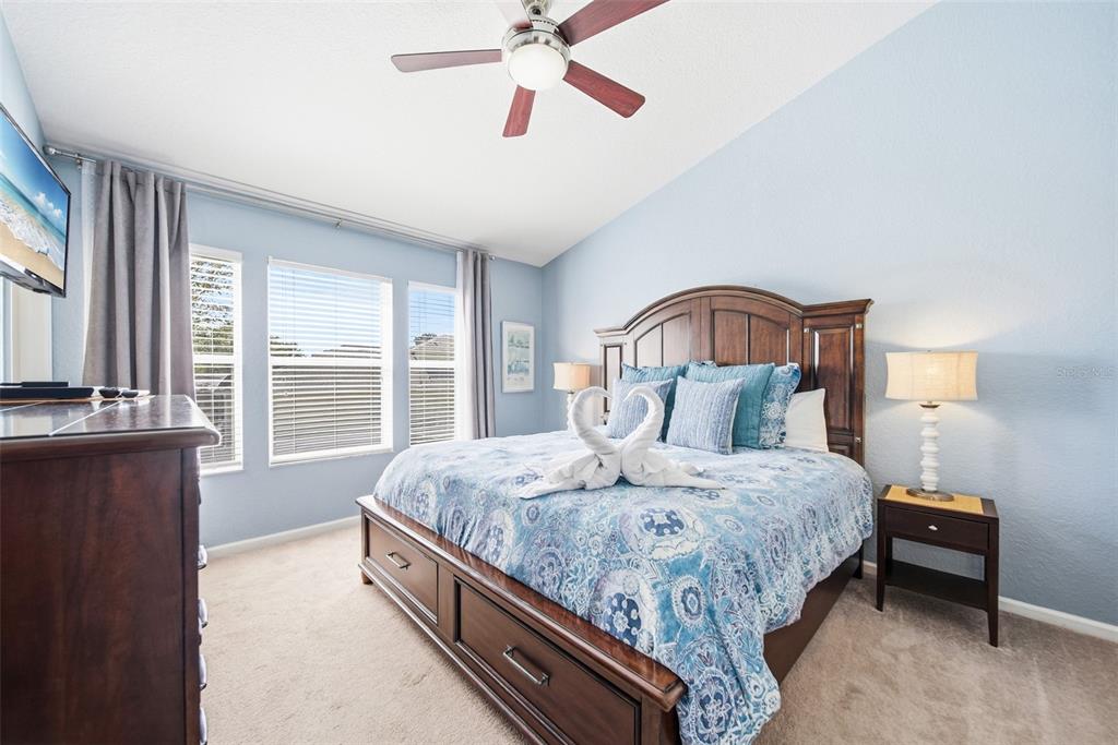 2556 Renshaw Street Kissimmee, FL 34747 - Photo 18 of 26 a bedroom with bed and window
