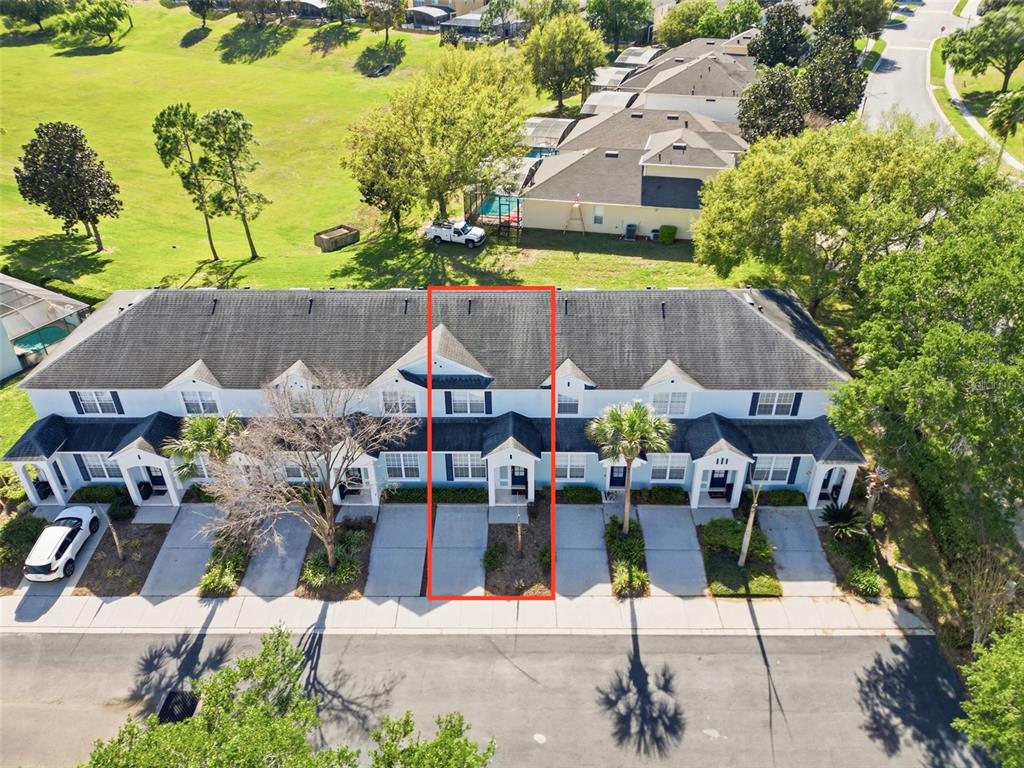 2556 Renshaw Street Kissimmee, FL 34747 - Photo 20 of 26 an aerial view of multiple houses with yard