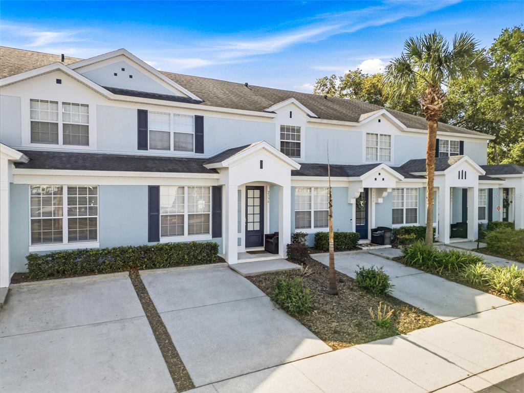 2556 Renshaw Street Kissimmee, FL 34747 - Photo 2 of 26 a front view of a house with a yard