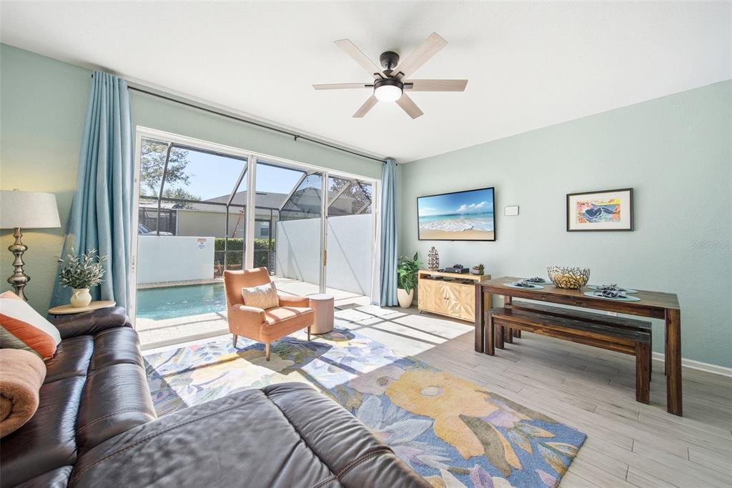 2556 Renshaw Street Kissimmee, FL 34747 - Photo 6 of 26 a living room with furniture and a window