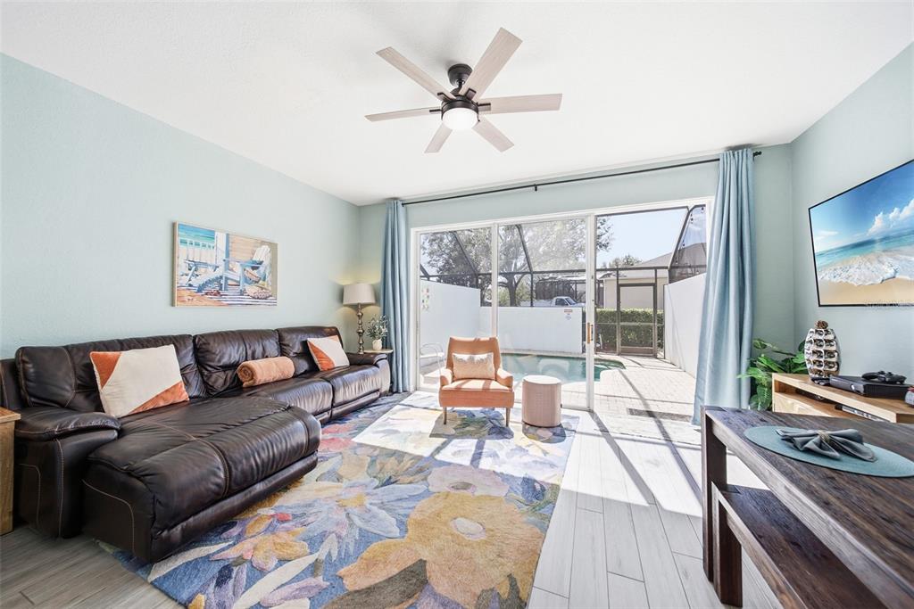 2556 Renshaw Street Kissimmee, FL 34747 - Photo 7 of 26 a living room with furniture and a large window
