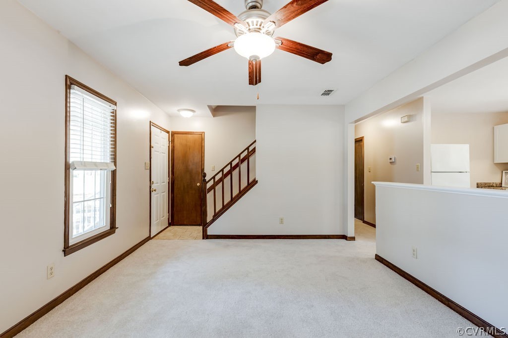 7005 Pointer Ridge Road Midlothian, VA 23112 - Photo 11 of 30 a view of a livingroom with a ceiling fan and window
