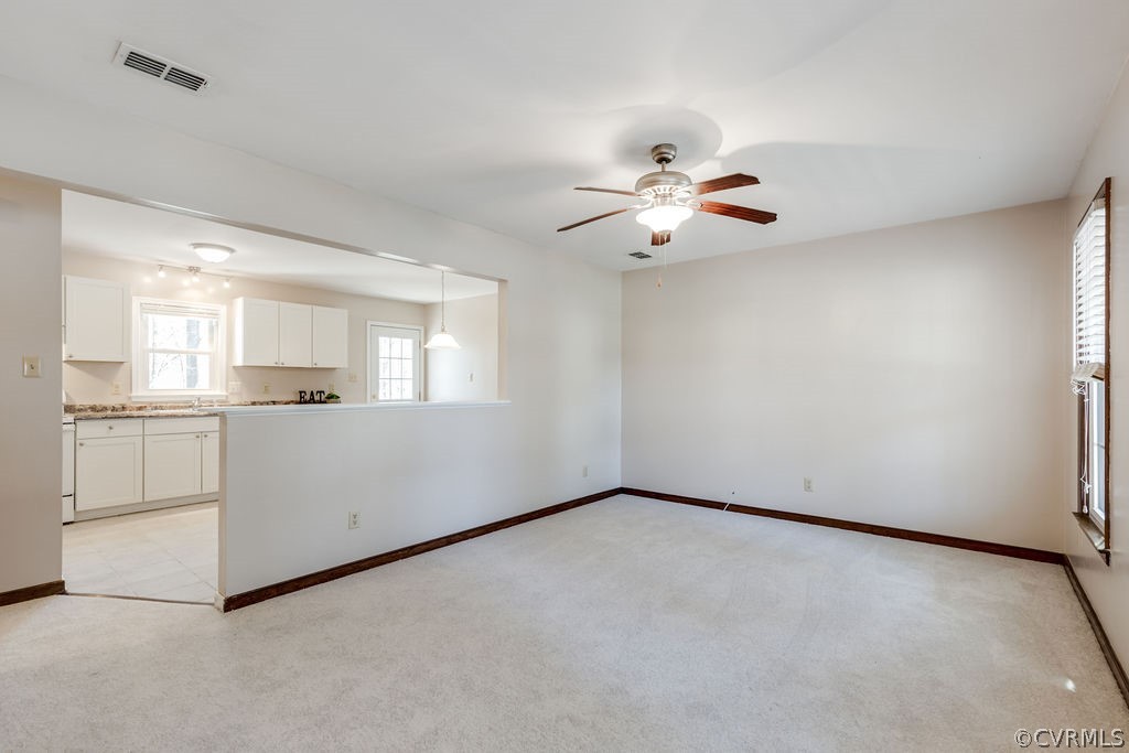 7005 Pointer Ridge Road Midlothian, VA 23112 - Photo 2 of 30 wooden floor in an empty room with a kitchen