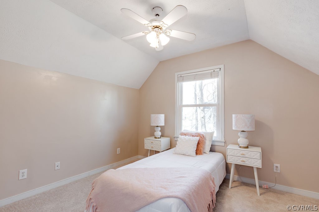 7005 Pointer Ridge Road Midlothian, VA 23112 - Photo 22 of 30 a bedroom with a white bed and a chandelier