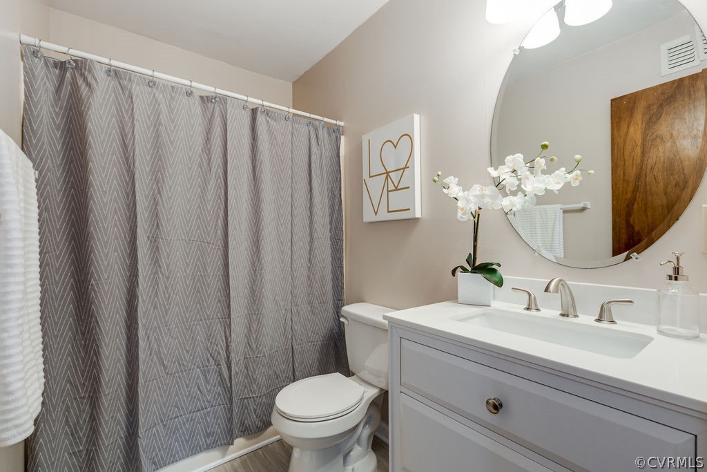 7005 Pointer Ridge Road Midlothian, VA 23112 - Photo 4 of 30 a bathroom with a sink mirror and toilet