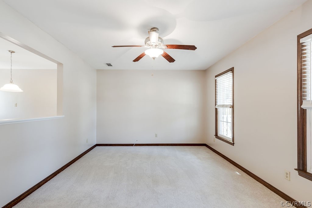 7005 Pointer Ridge Road Midlothian, VA 23112 - Photo 8 of 30 an empty room with windows and fan