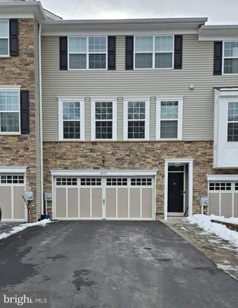 a front view of a house with a garage