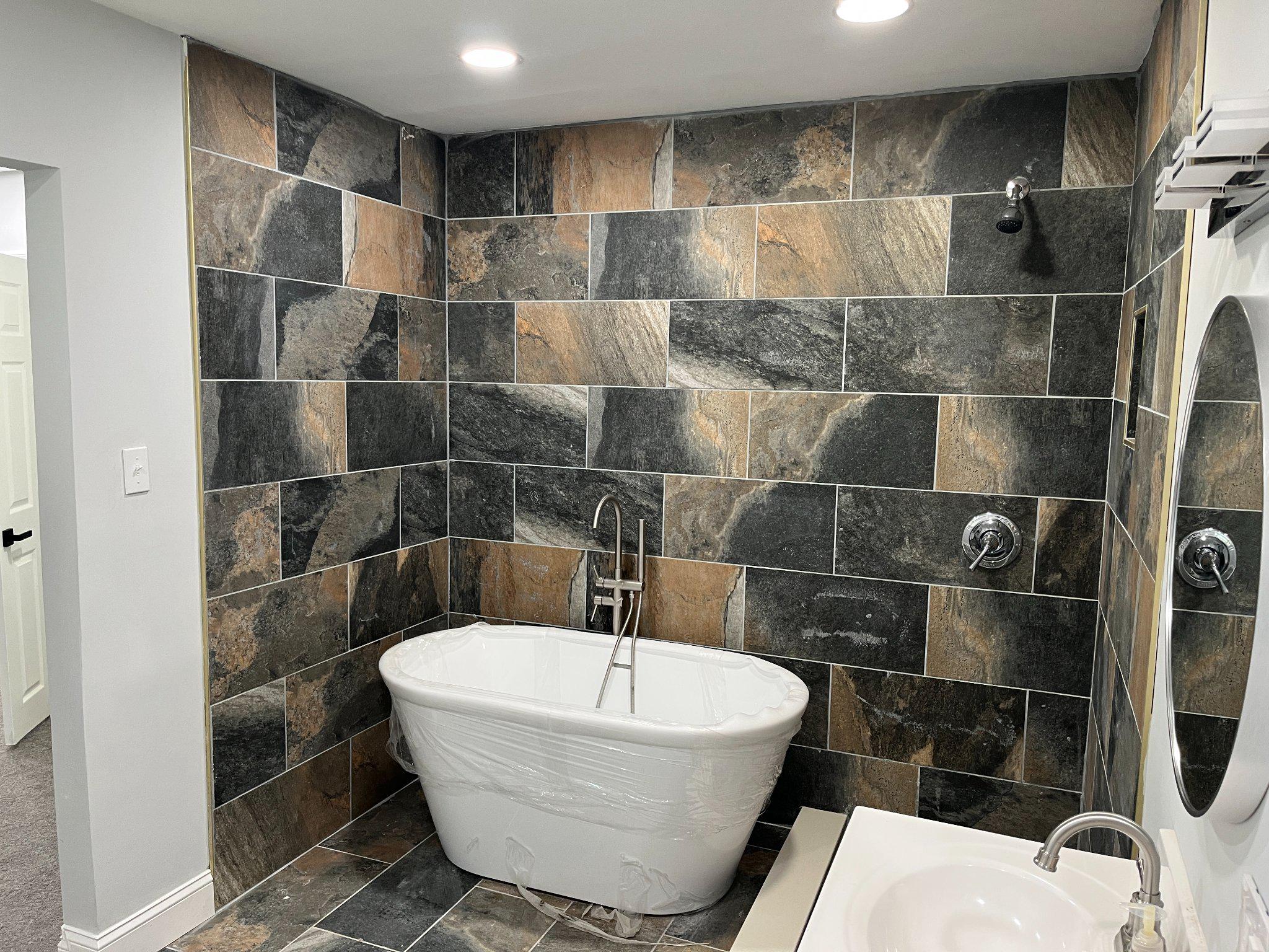 2405 Limestone Road Wilmington, DE 19808 - Photo 29 of 40 a bathroom with a bathtub and shower