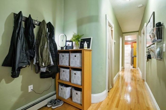 68 Calumet Street, Unit 3 Boston, MA 02120 - Photo 7 of 9 a view of walk in closet with clothes and shoes