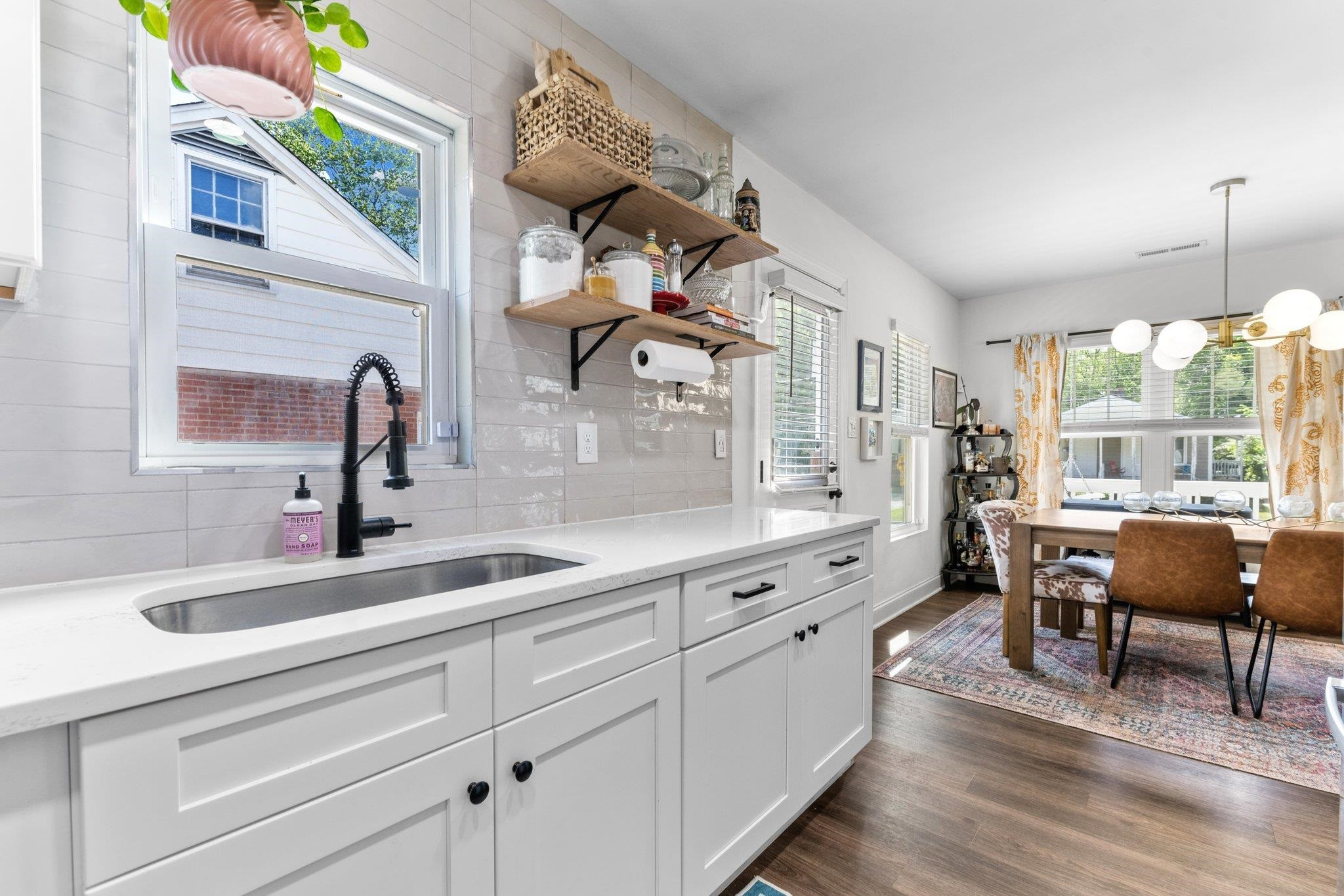 809 Coleman Street Raleigh, NC 27610 - Photo 11 of 70 a kitchen with cabinets a sink outdoor seating and view living room