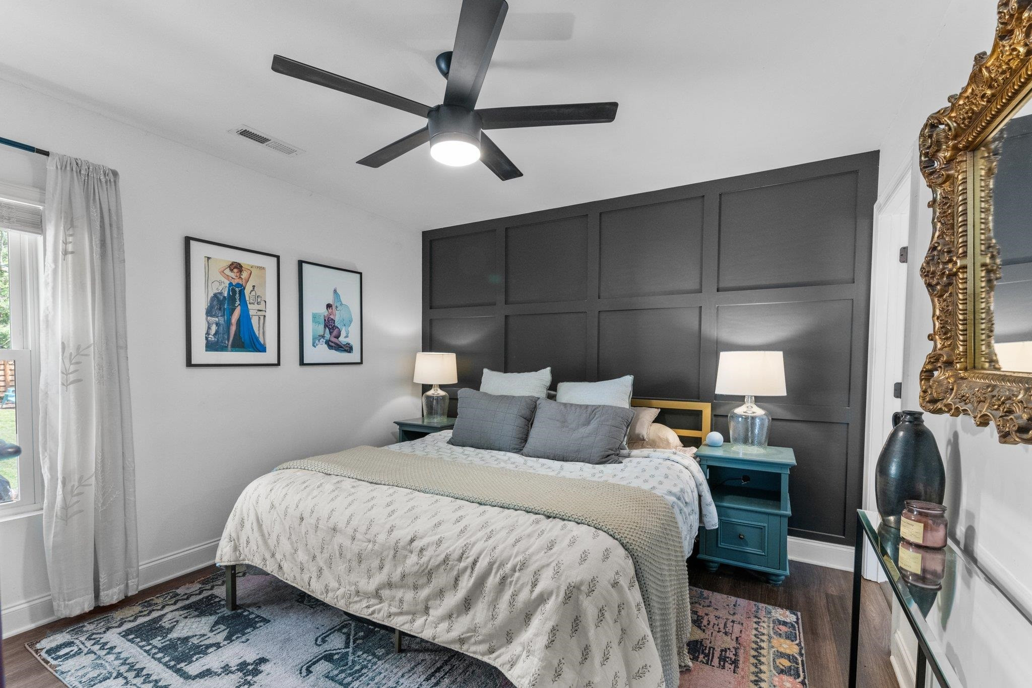 809 Coleman Street Raleigh, NC 27610 - Photo 12 of 70 a bedroom with a bed and a chandelier