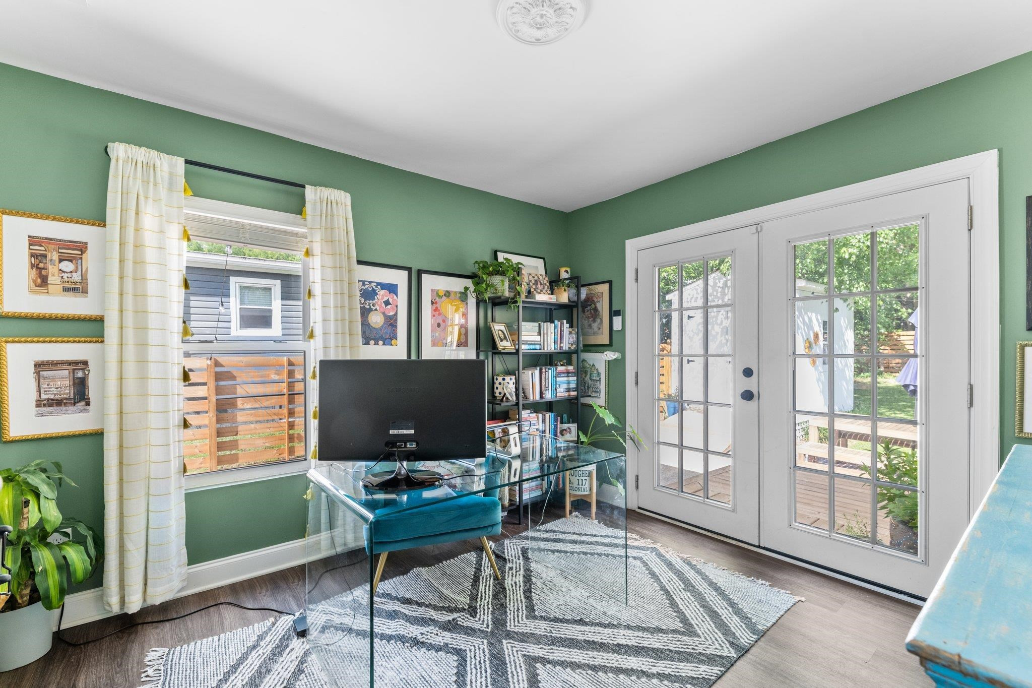809 Coleman Street Raleigh, NC 27610 - Photo 17 of 70 a living room with furniture a flat screen tv and a window