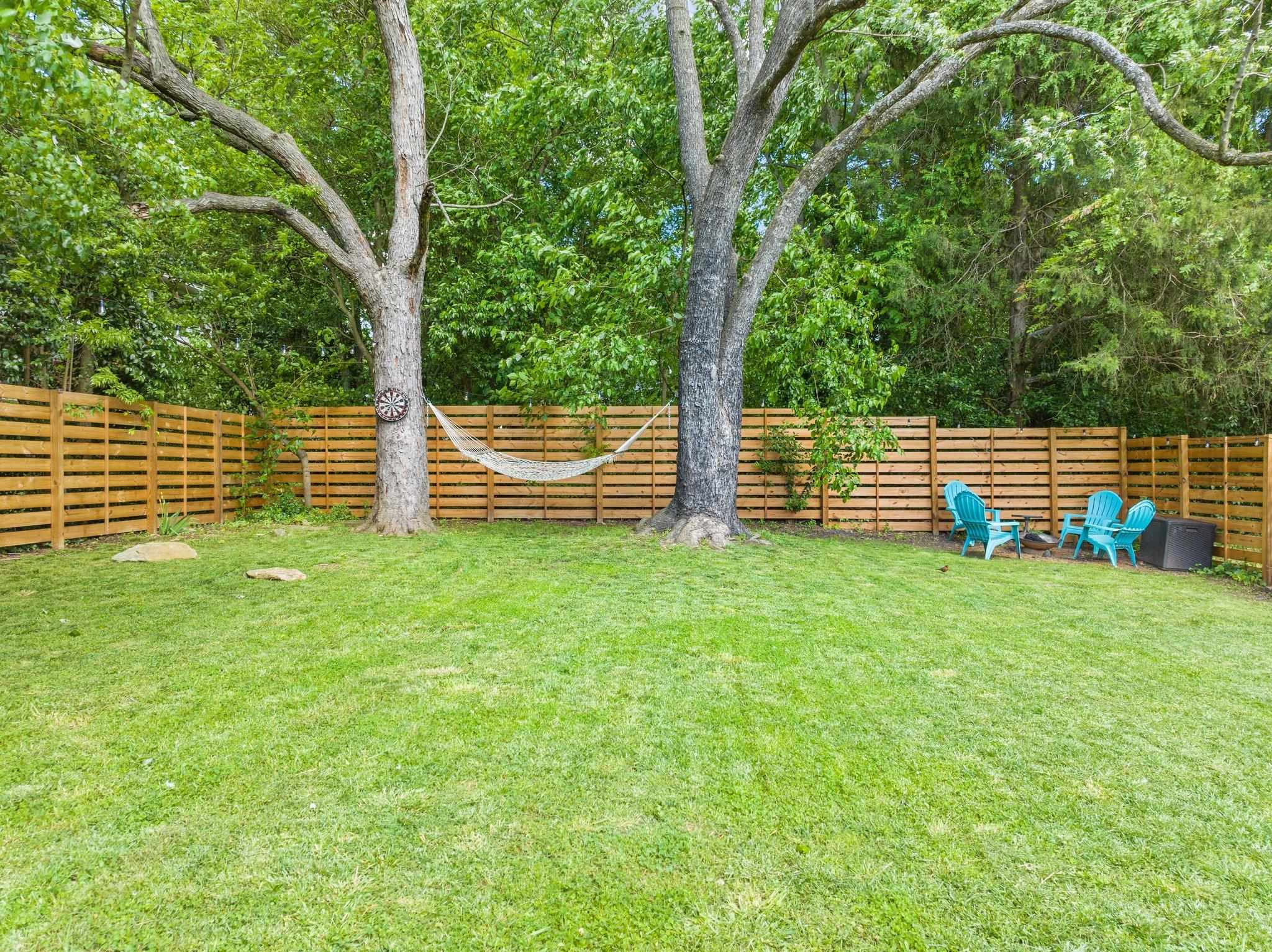 809 Coleman Street Raleigh, NC 27610 - Photo 33 of 70 a view of outdoor space with deck and trees