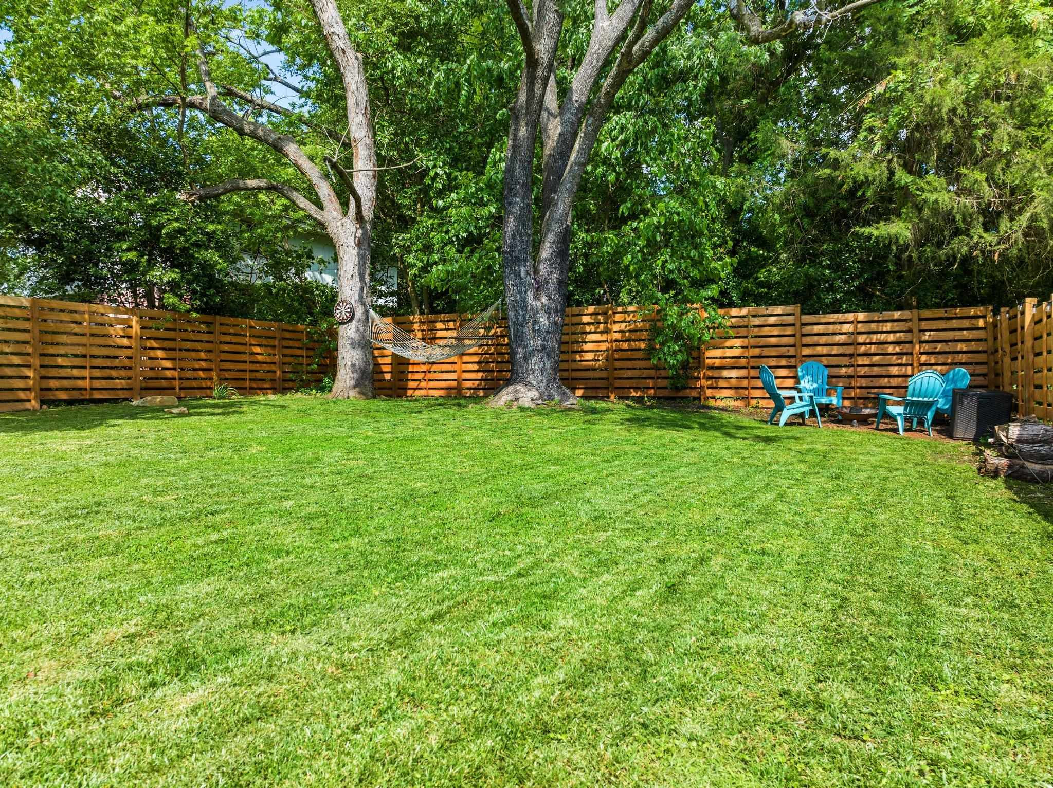 809 Coleman Street Raleigh, NC 27610 - Photo 35 of 70 a backyard of a house with lots of green space