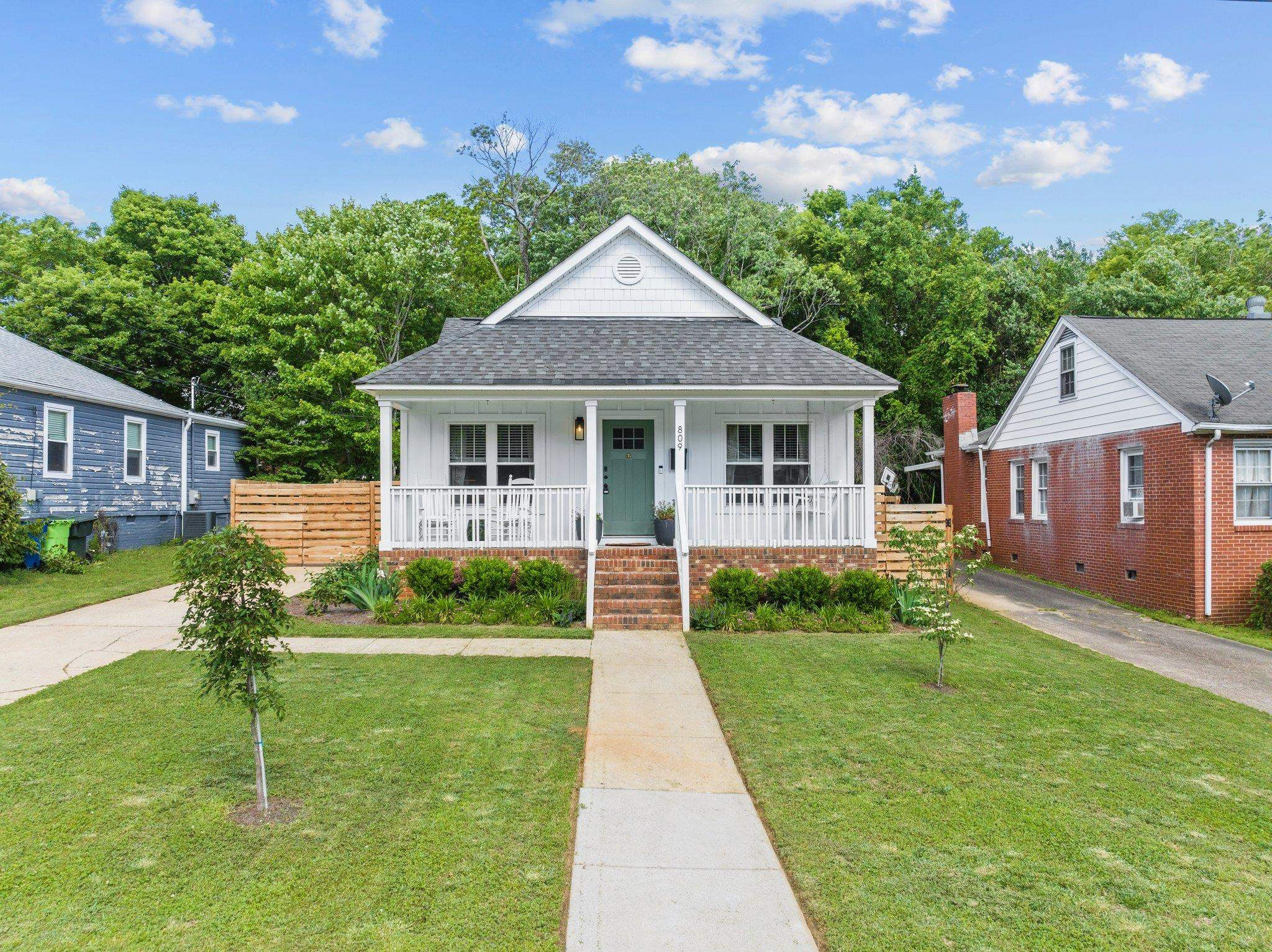 809 Coleman Street Raleigh, NC 27610 - Photo 42 of 70 a front view of a house with a yard and porch