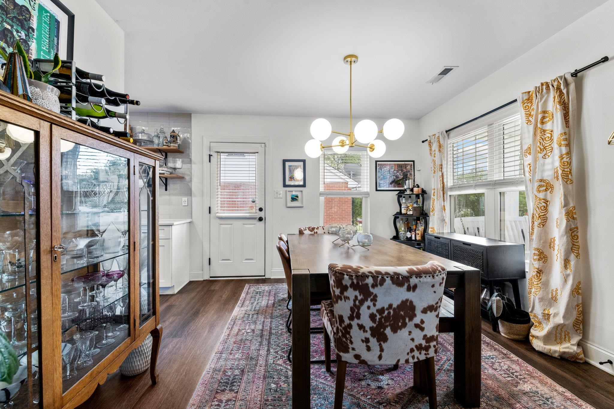 809 Coleman Street Raleigh, NC 27610 - Photo 7 of 70 a view of a dining room with furniture window and wooden floor