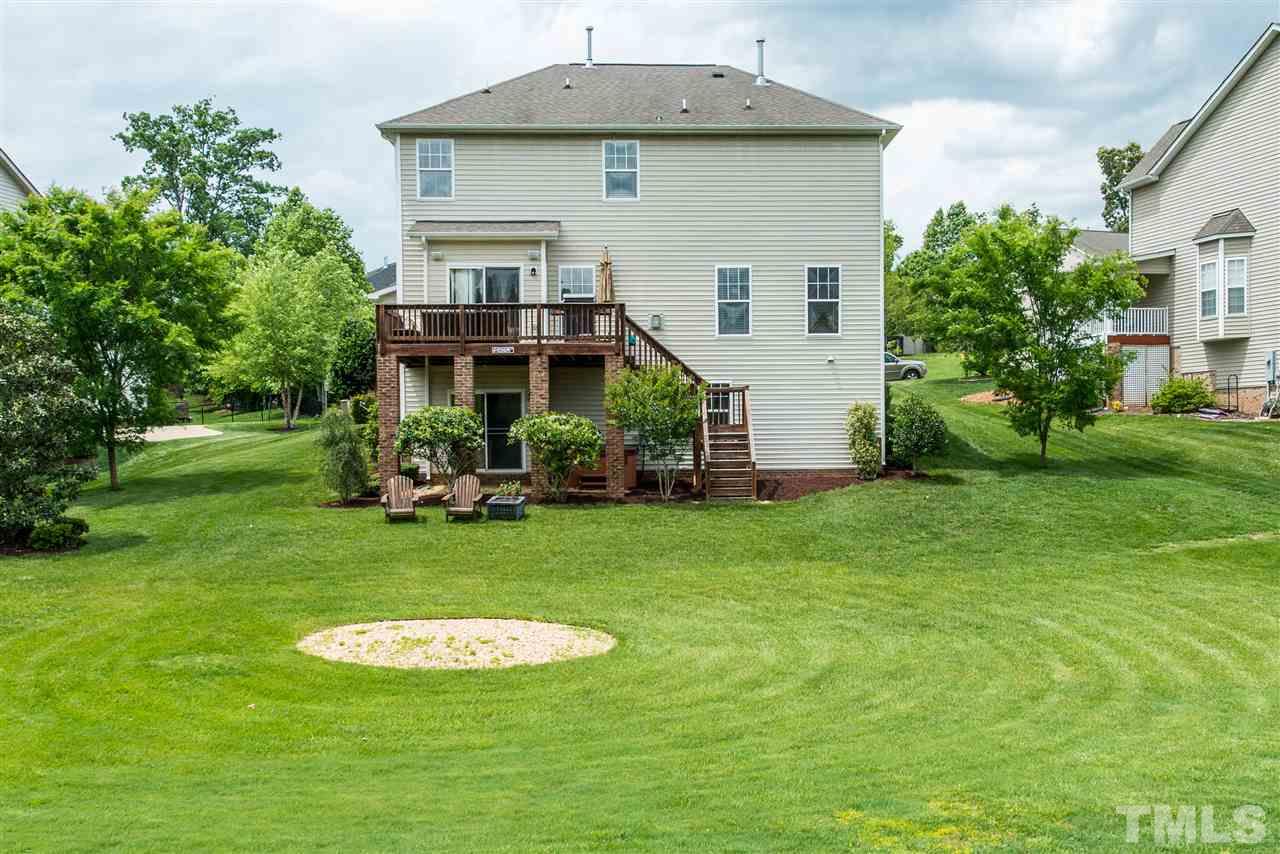 160 Locke Woods Road Raleigh, NC 27603 - Photo 22 of 25 a front view of a house with a garden