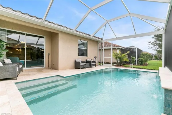 a view of a swimming pool with a patio