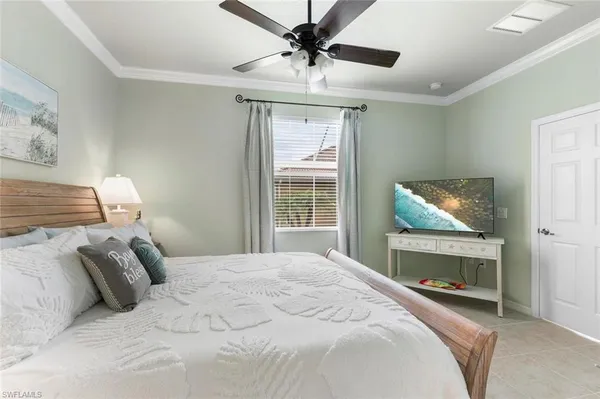 a bedroom with a bed and a fireplace