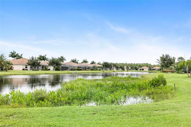 a view of a lake with houses in the back