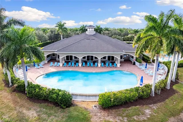 an aerial view of a house with garden space and sitting area