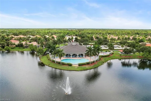 a view of a lake with houses in outdoor space
