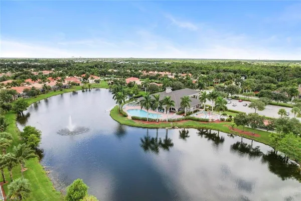 an aerial view of a house with a lake view