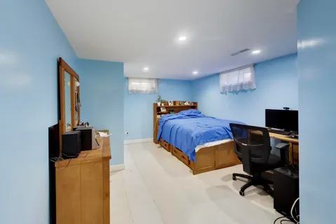 a bedroom with a workspace