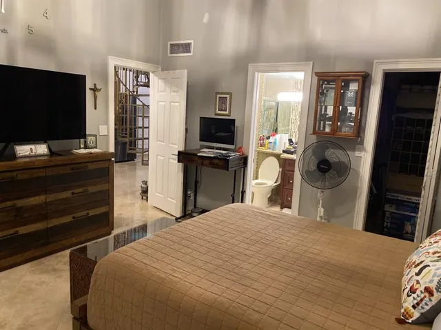 a kitchen with stainless steel appliances kitchen island granite countertop a sink and cabinets