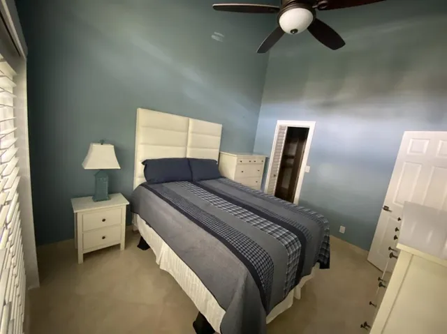 a bed room with a bed and a window