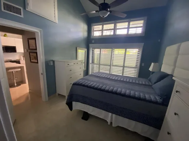 a bedroom with bed and window