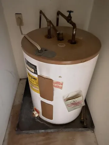 a roof deck with couches and wooden floor