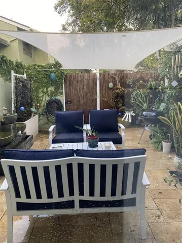 an aerial view of a residential houses with street