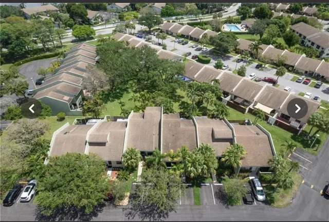 an aerial view of house with a yard