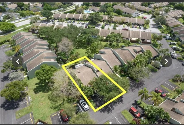 an aerial view of a house with a garden