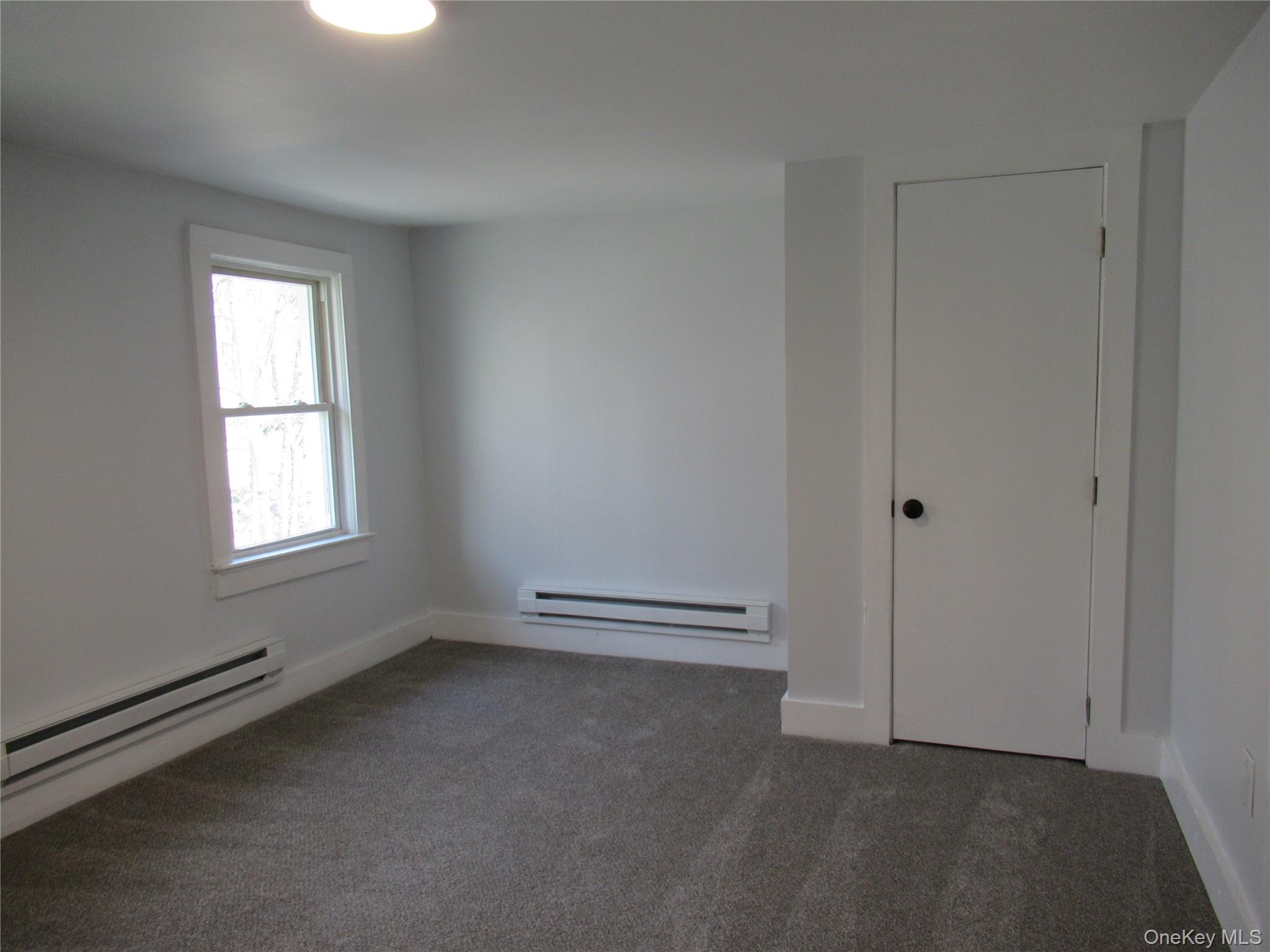 300 Old Rte 55, Unit 5 Poughquag, NY 12570 - Photo 13 of 20 a view of an empty room with a window