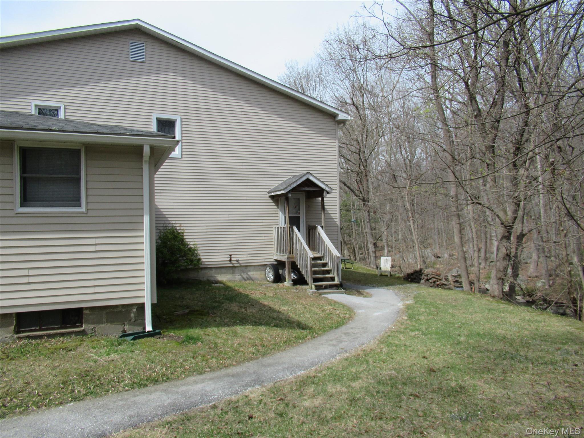 300 Old Rte 55, Unit 5 Poughquag, NY 12570 - Photo 19 of 20 a view of a house with a backyard