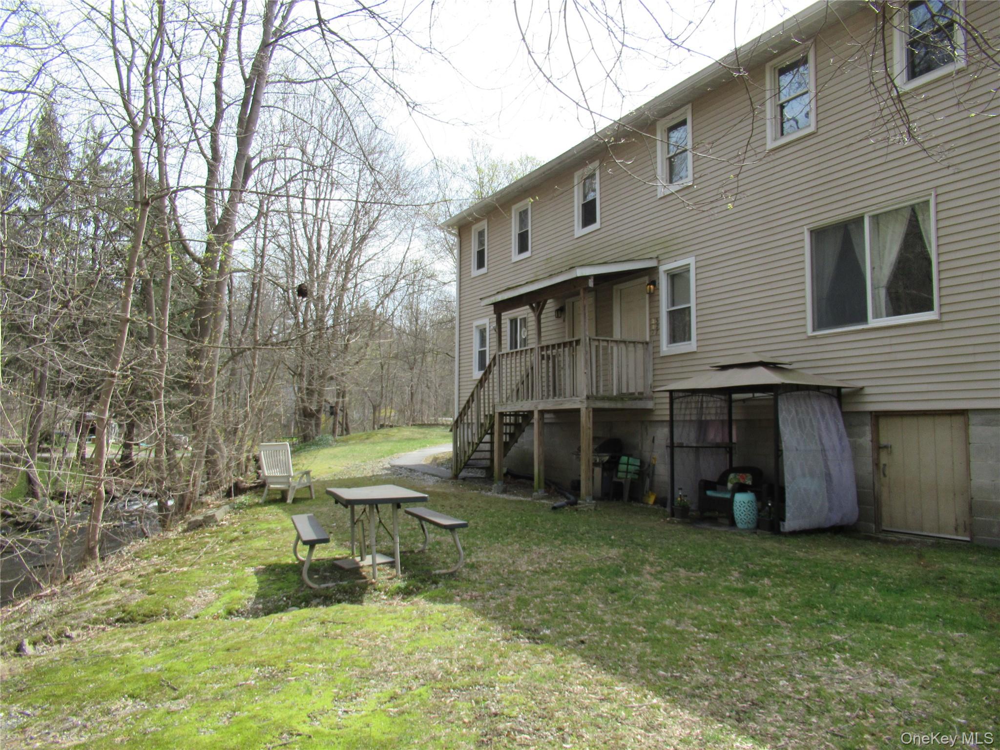 300 Old Rte 55, Unit 5 Poughquag, NY 12570 - Photo 20 of 20 a view of an house with backyard porch and sitting area