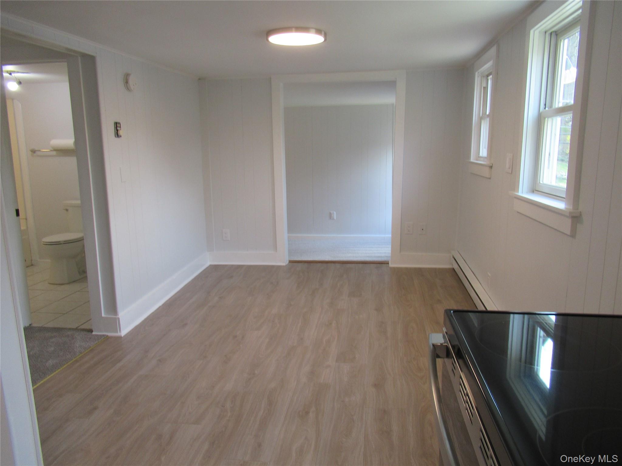 300 Old Rte 55, Unit 5 Poughquag, NY 12570 - Photo 9 of 20 wooden floor in an empty room with a window
