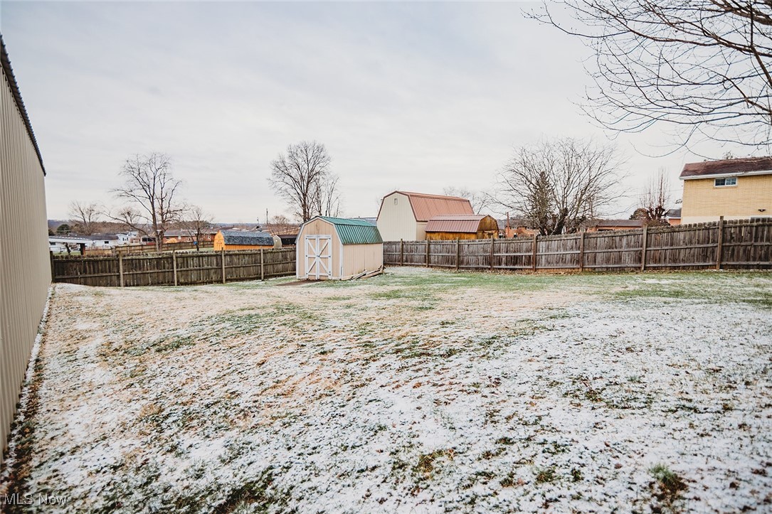 91 Mike Street Washington, WV 26181 - Photo 33 of 42 Fenced backyard with a shed