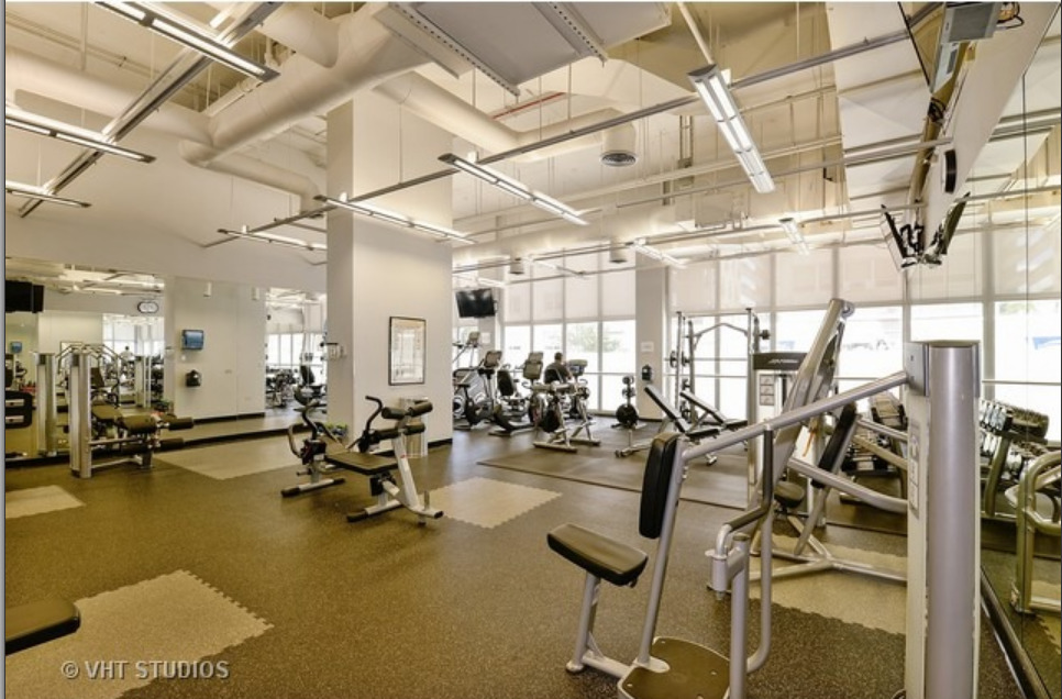 Undisclosed Address Chicago, IL 60613 - Photo 12 of 15 a view of a room with gym equipment