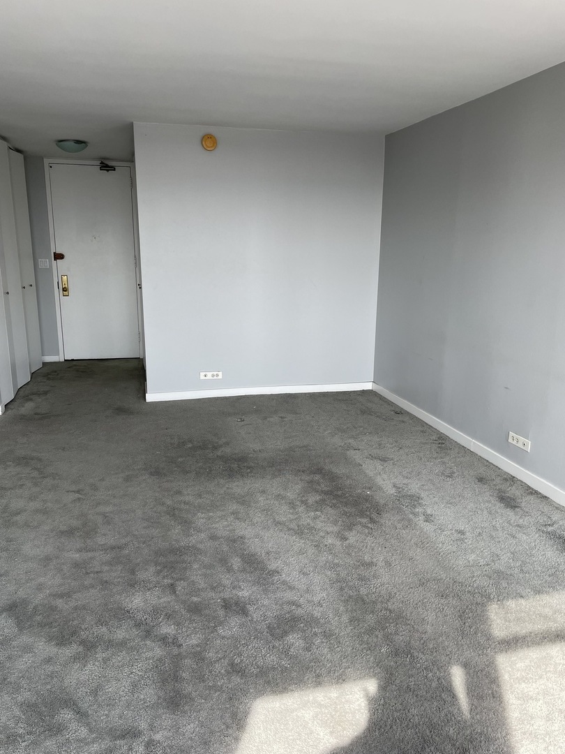 Undisclosed Address Chicago, IL 60613 - Photo 5 of 15 a view of an empty room
